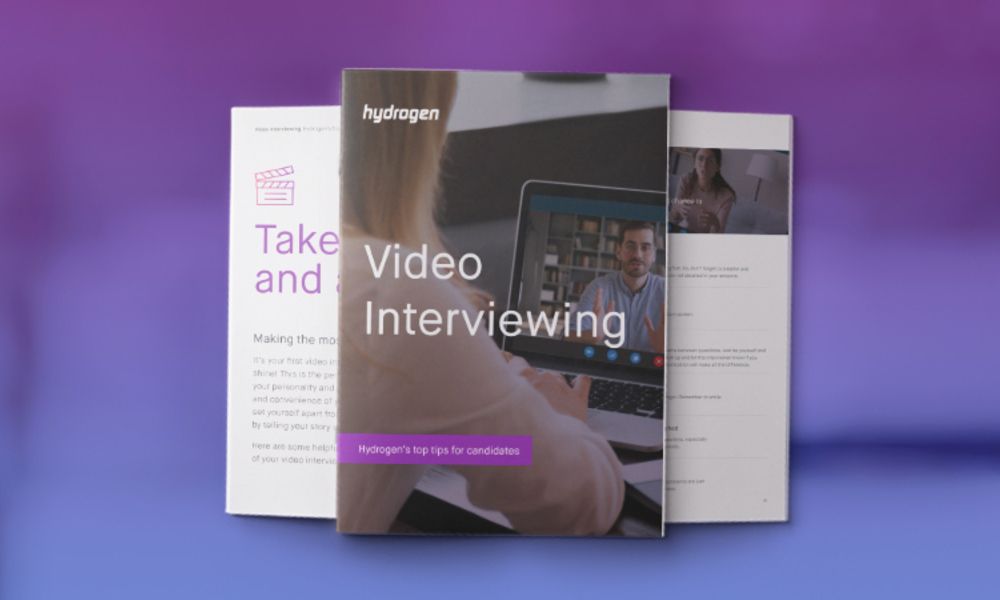 A book titled take video and interviewing is sitting on top of a purple table.
