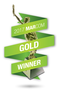 A picture of a statue that says gold winner