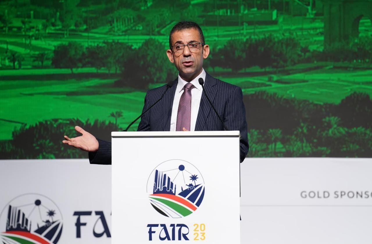 A man in a suit and tie is standing at a podium giving a speech.