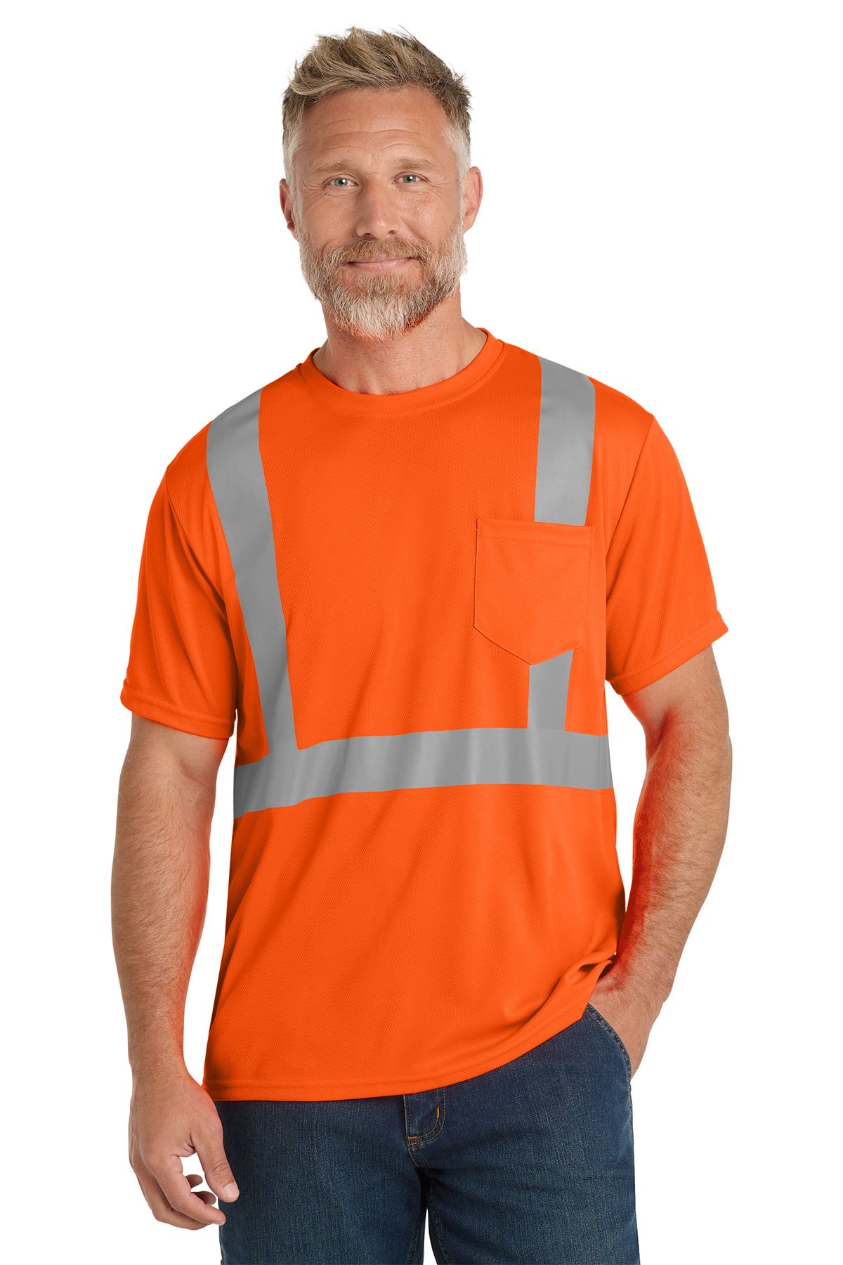 Man wearing a neon green safety shirt with reflective stripes and a pocket, standing.