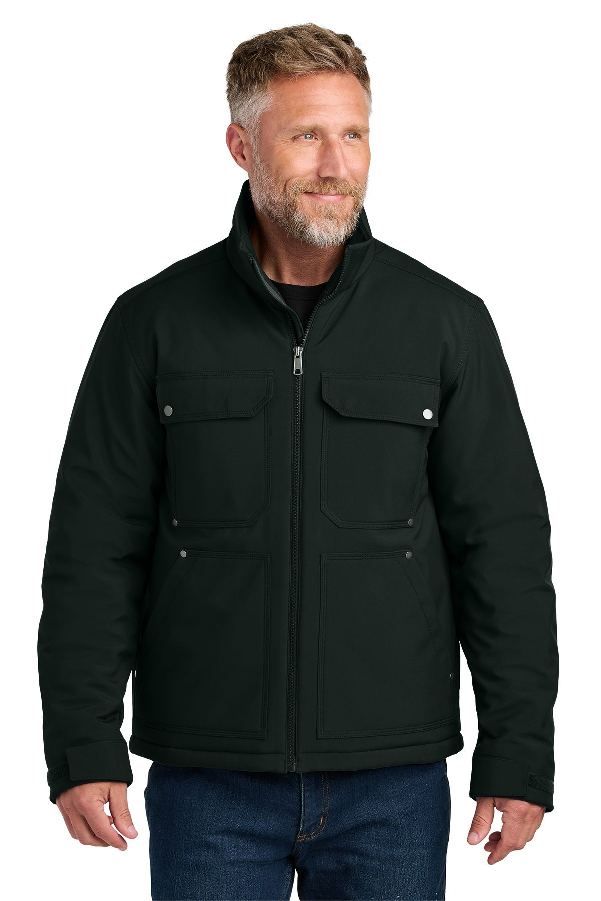 Man wearing a gray insulated jacket with four front pockets, standing outside.