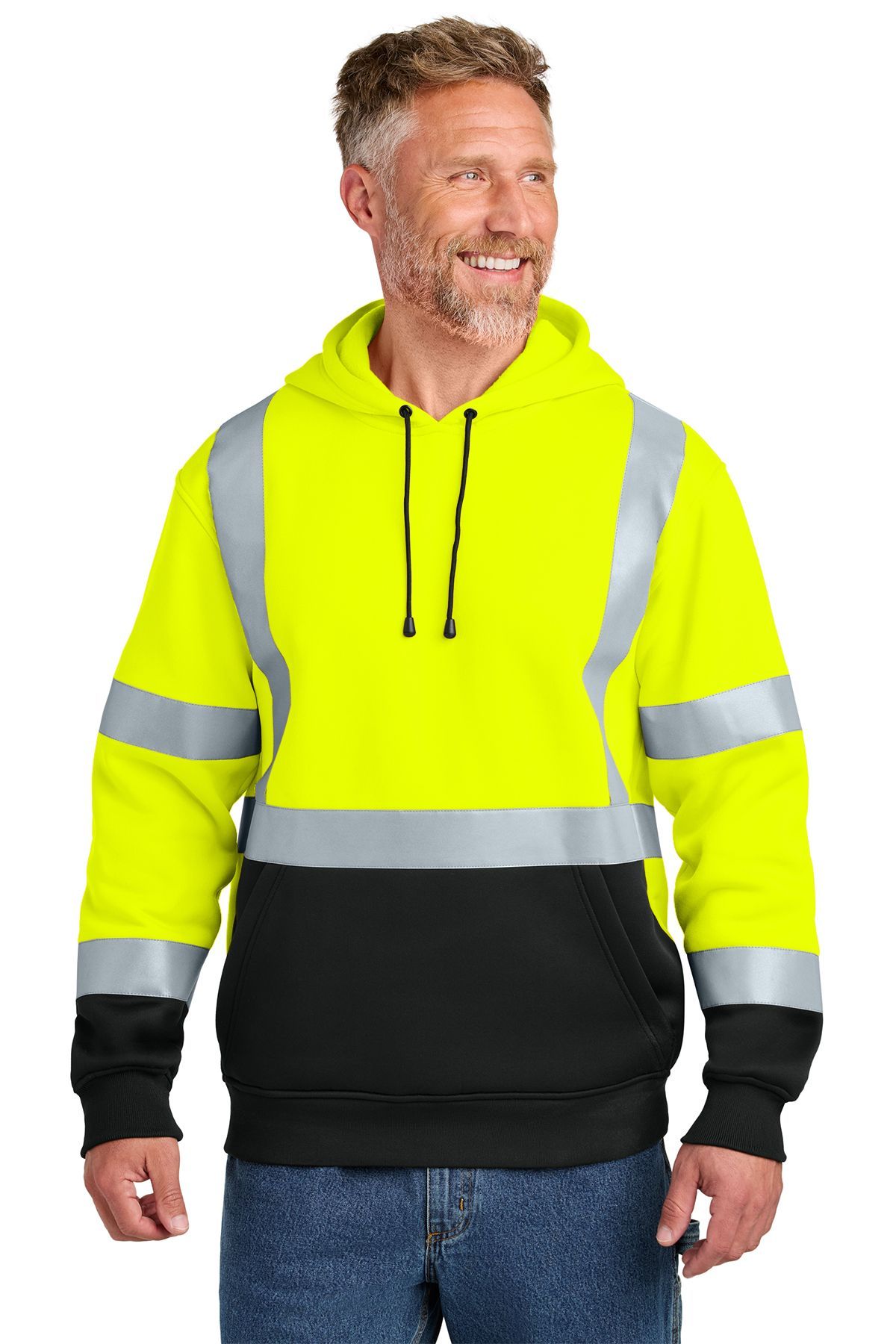 Man wearing a yellow and black high-visibility hooded sweatshirt with reflective stripes, smiling.