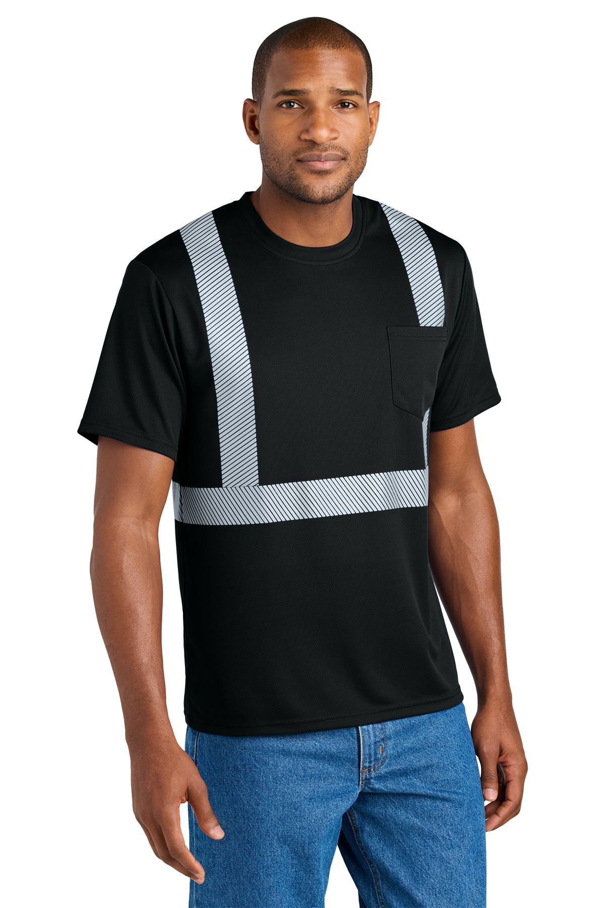 Man wearing a blue safety t-shirt with reflective stripes and a pocket, standing.