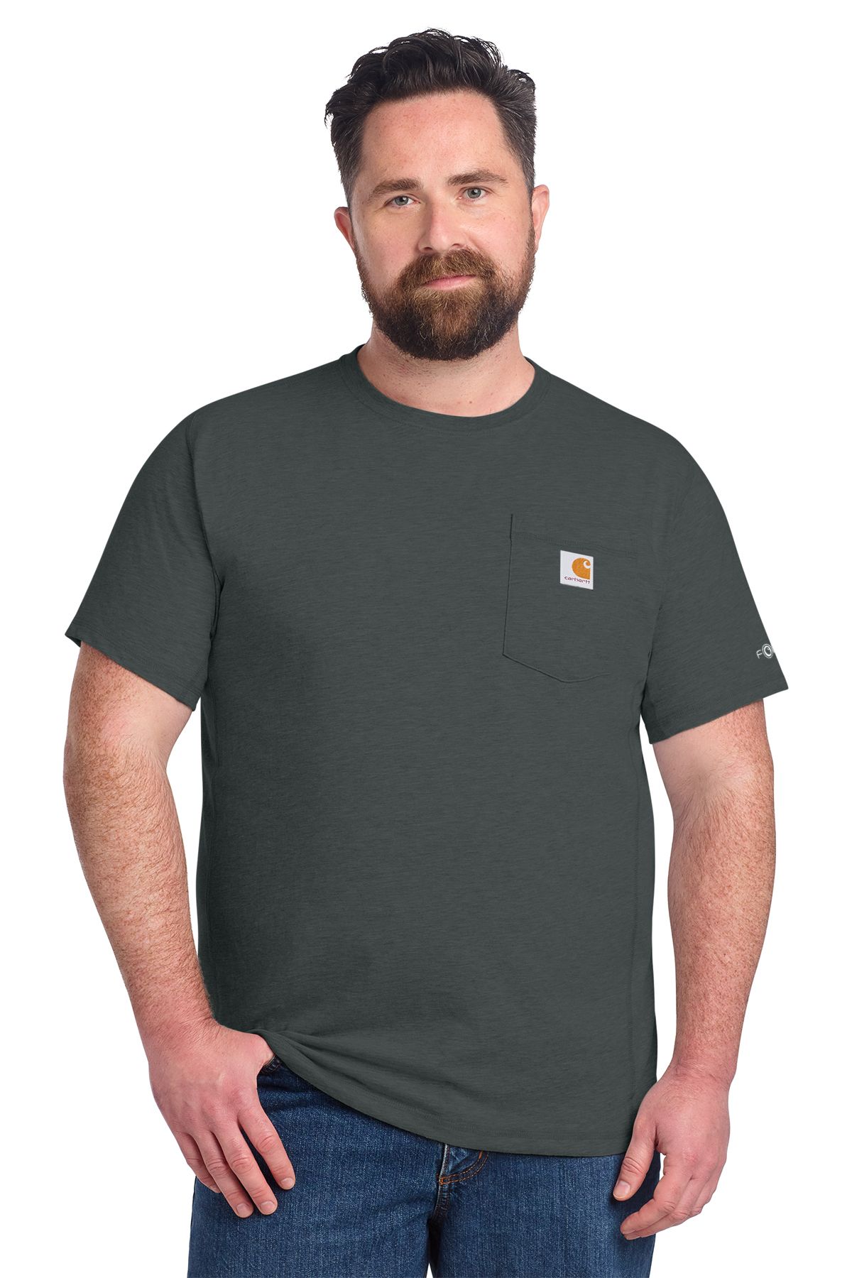 Man wearing a dark gray Carhartt t-shirt with a pocket, standing, blue jeans.