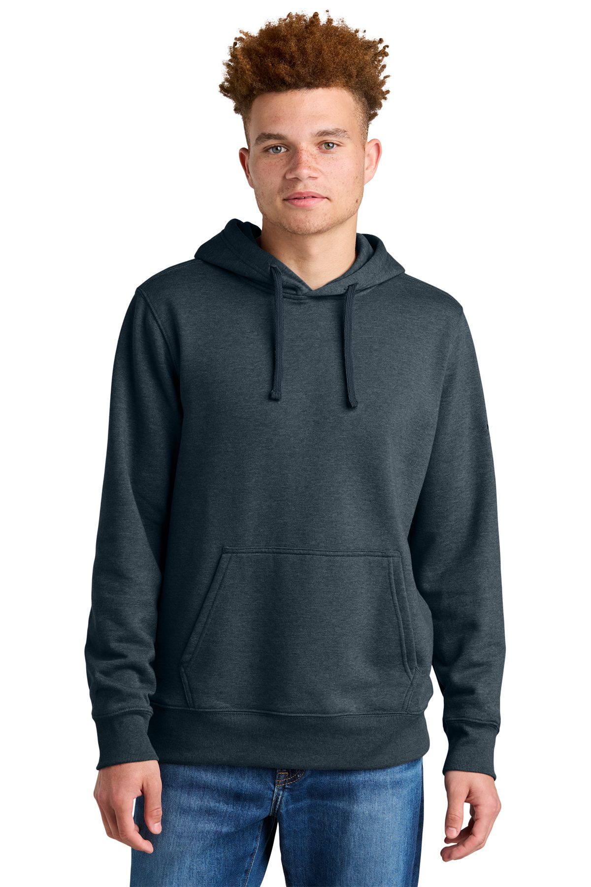 Man wearing a green hooded sweatshirt and jeans, looking at the camera.