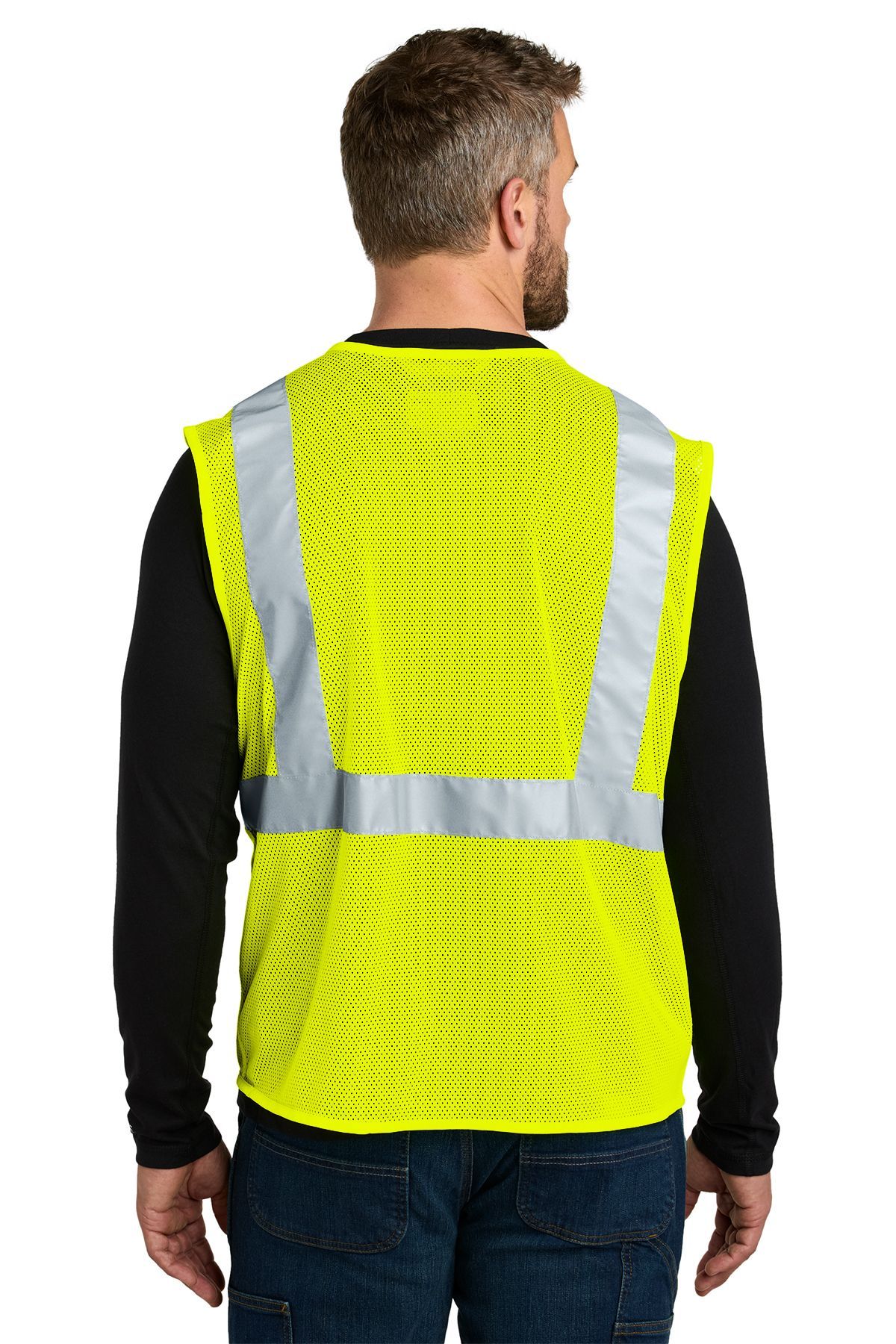 Man wearing a yellow safety vest over a black long-sleeved shirt and jeans.