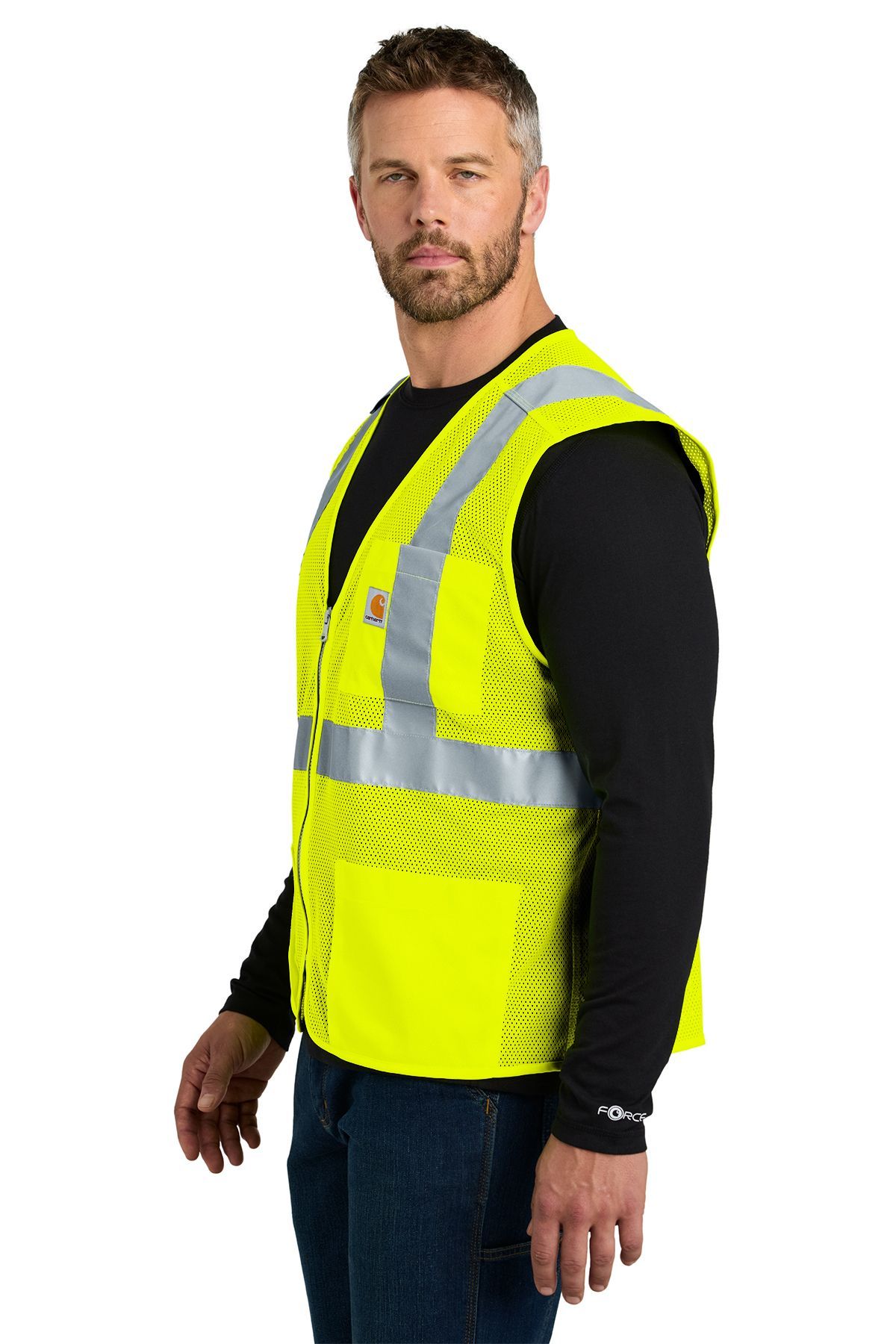 Man wearing a yellow safety vest over a black long-sleeved shirt and jeans.