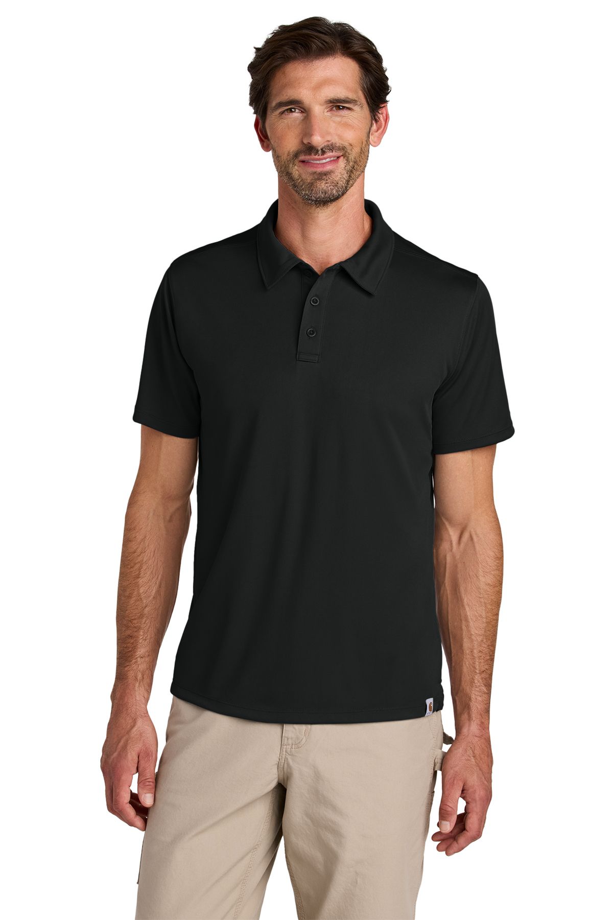 Man in black polo shirt and khaki pants, smiling.