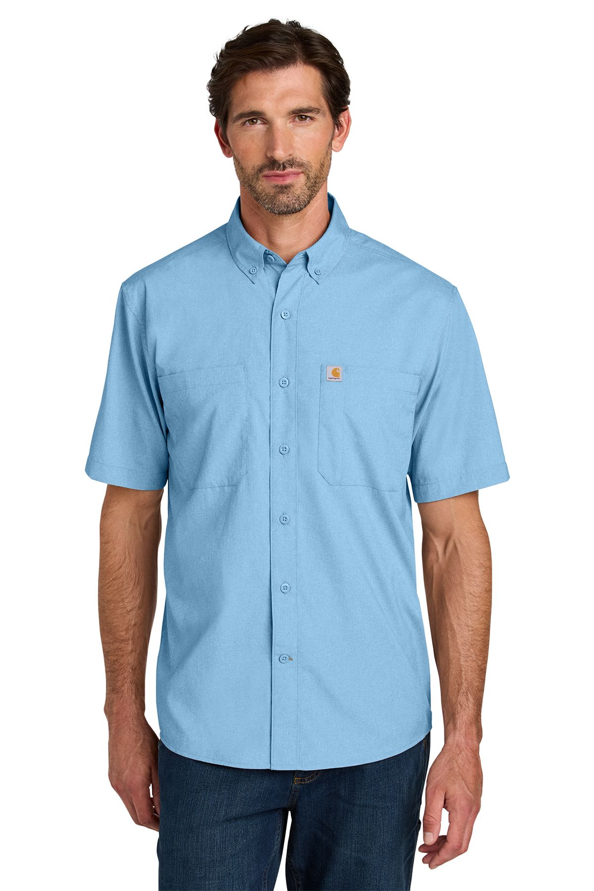 Man wearing a light blue short-sleeved button-down shirt over blue jeans.