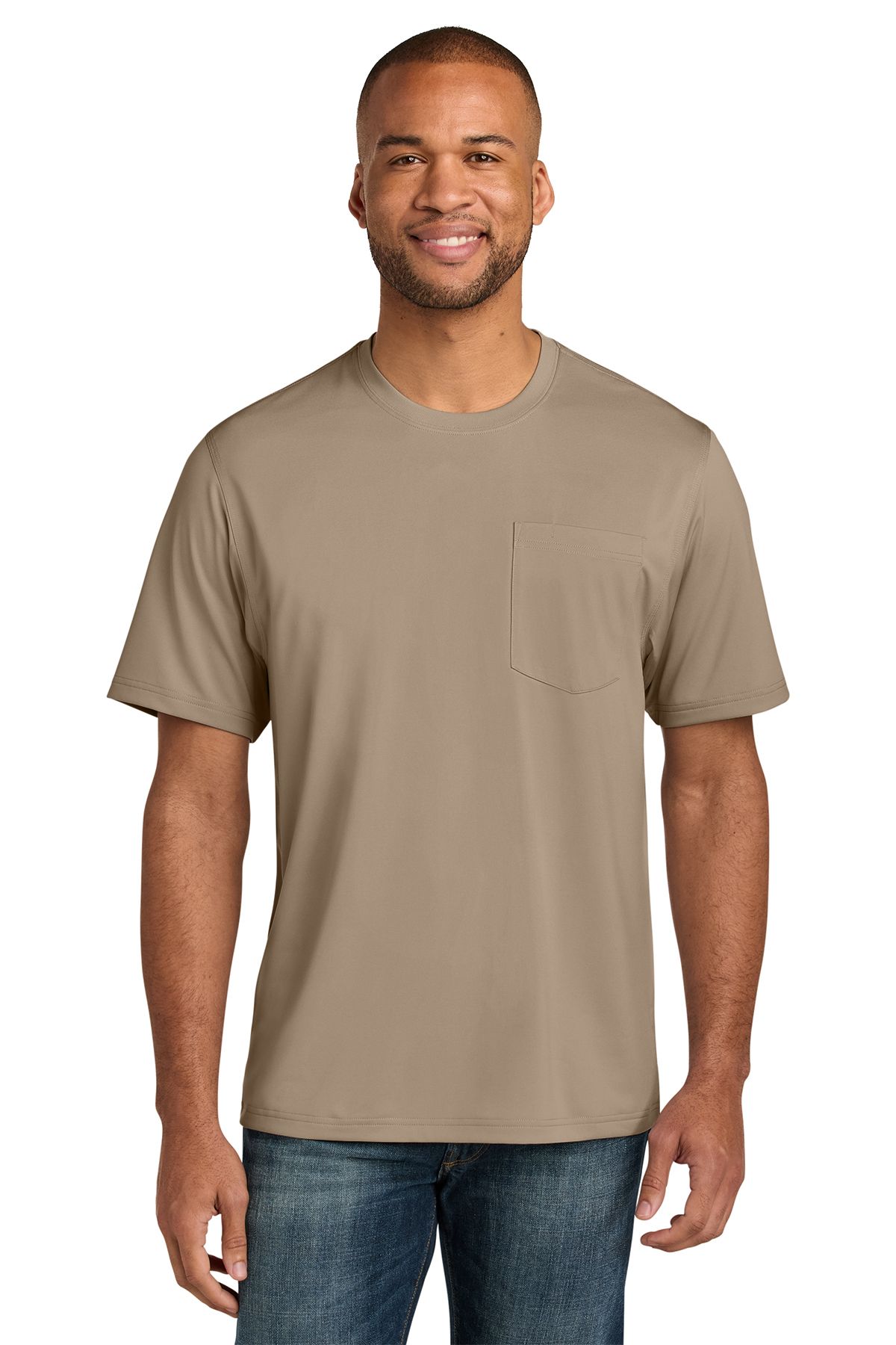 Man wearing a tan pocket t-shirt and jeans, smiling.