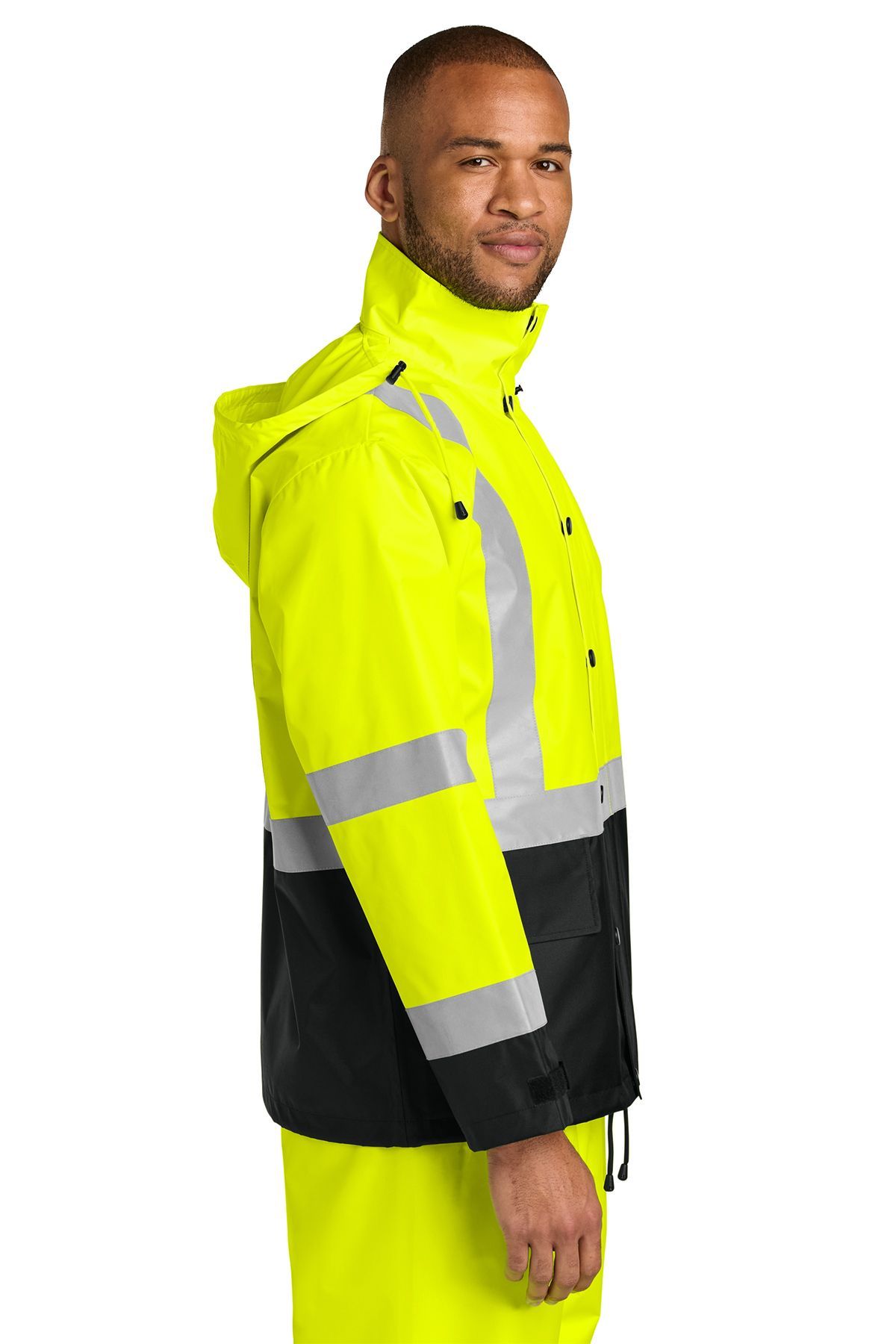 Man wearing a high-visibility yellow and black safety jacket with reflective stripes.
