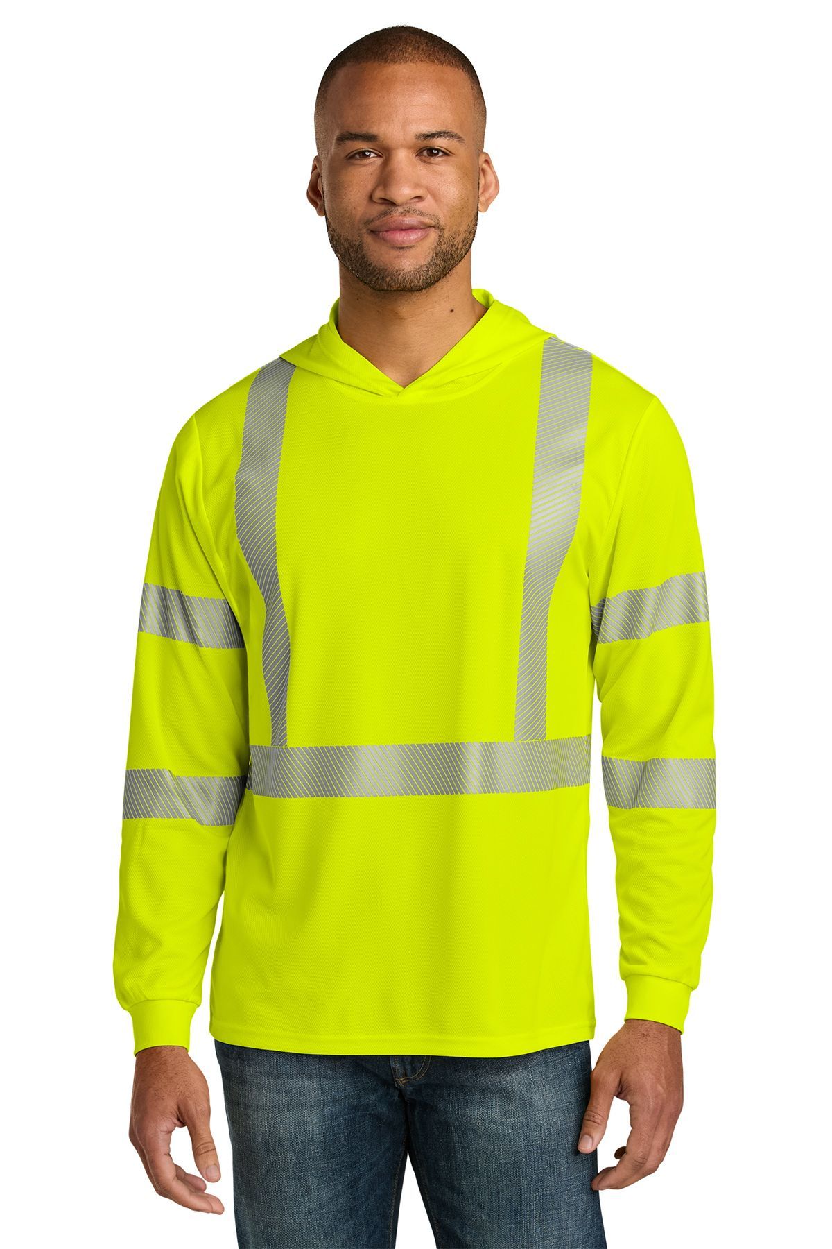 Man wearing a high-visibility yellow hooded shirt with reflective stripes over jeans.