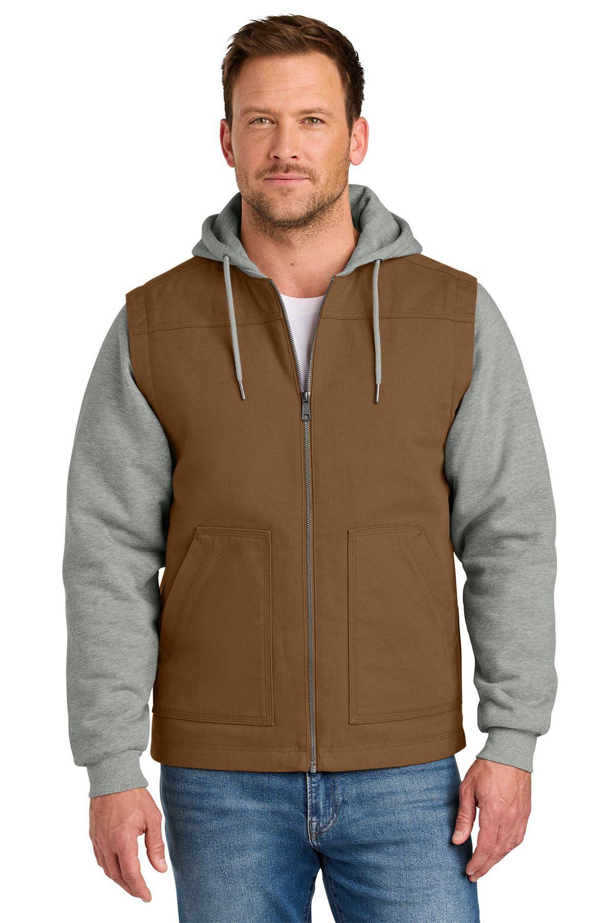Man in navy vest with gray hoodie and sleeves, blue jeans.