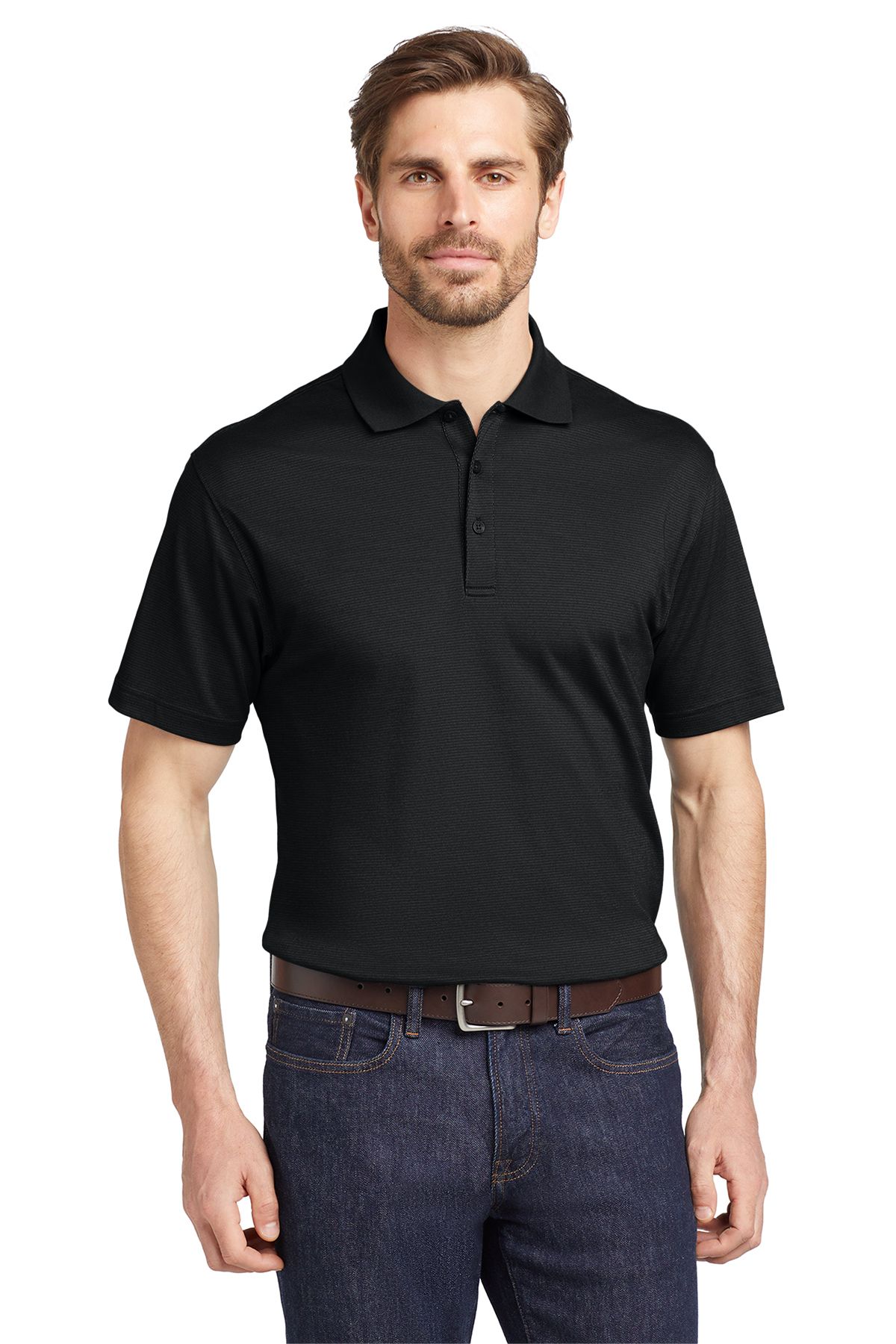 Man wearing a black polo shirt and blue jeans, standing in front of a white background.