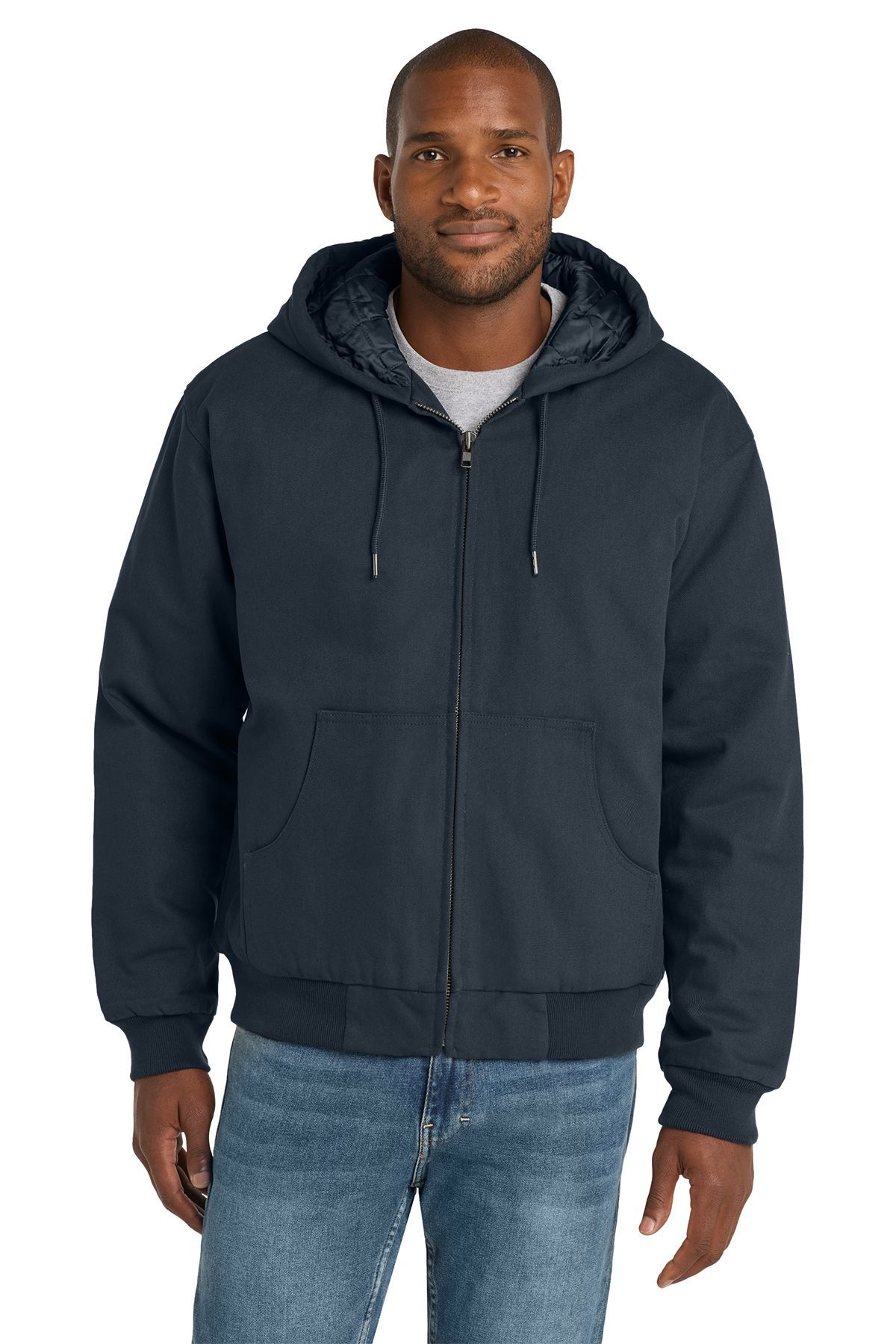 Man in a dark gray hooded jacket, zipped up, and blue jeans.