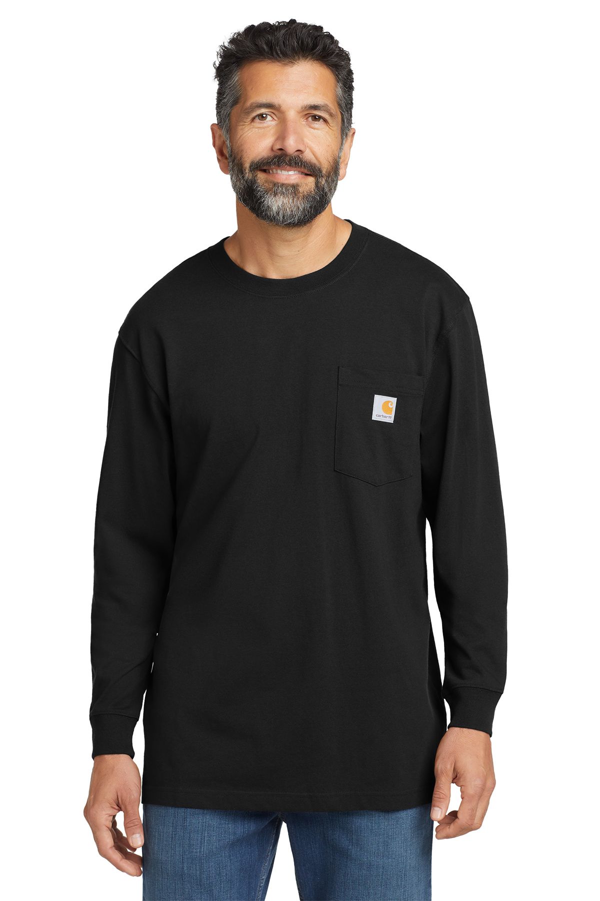 Man in black long-sleeve shirt with a pocket, wearing jeans. Smiling.