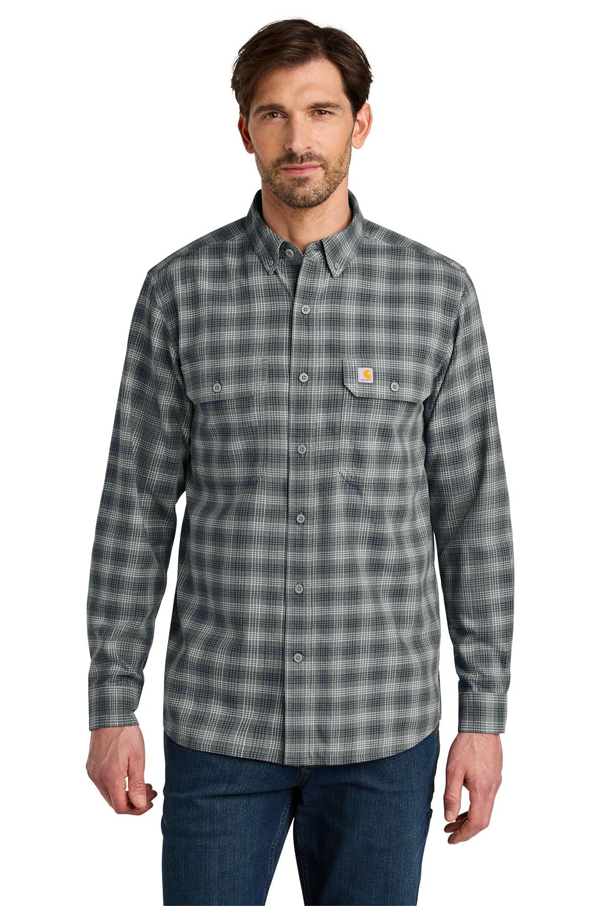 Man wearing a long-sleeve plaid shirt and jeans, standing.