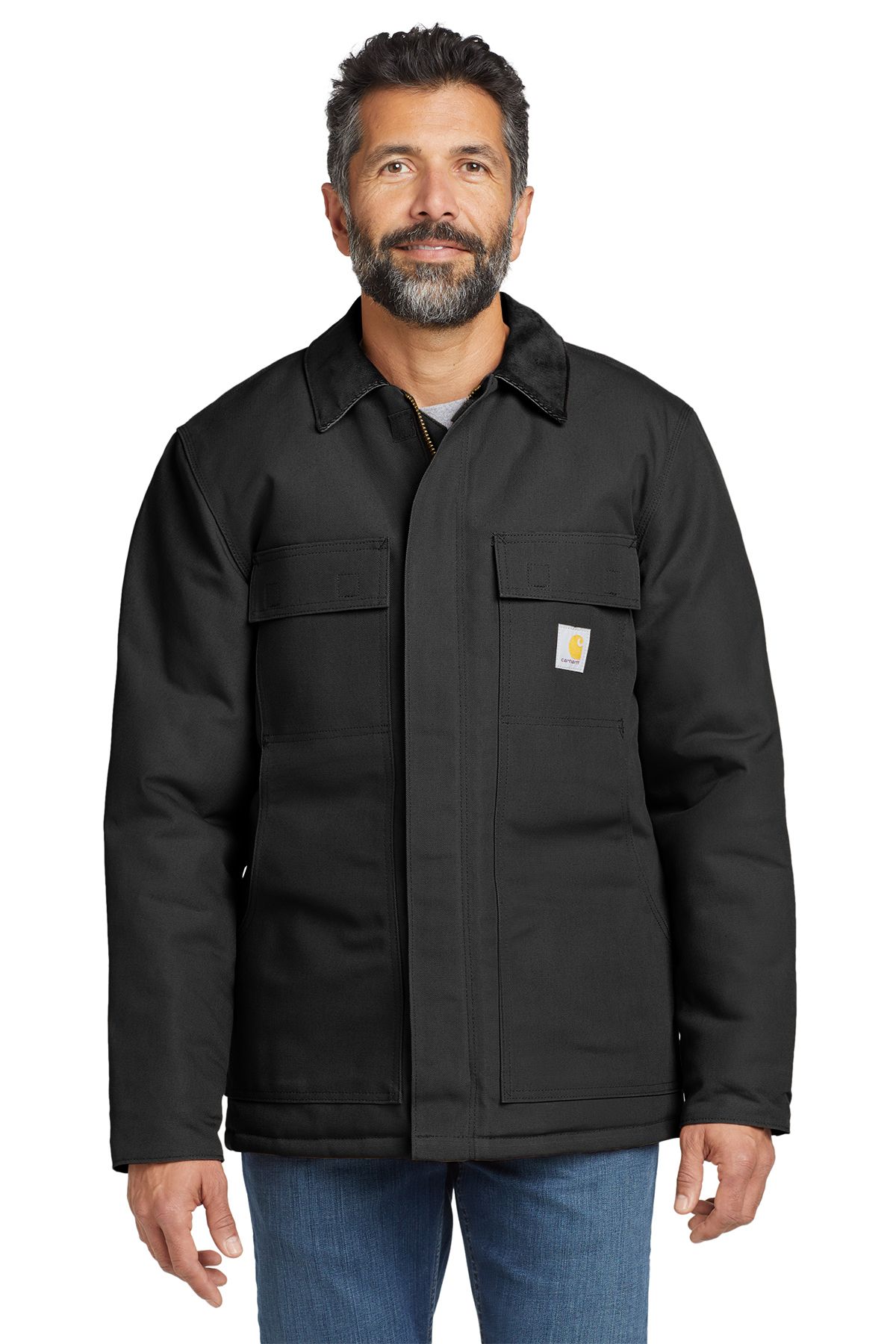 Man in a brown Carhartt jacket, standing outdoors, looking forward.
