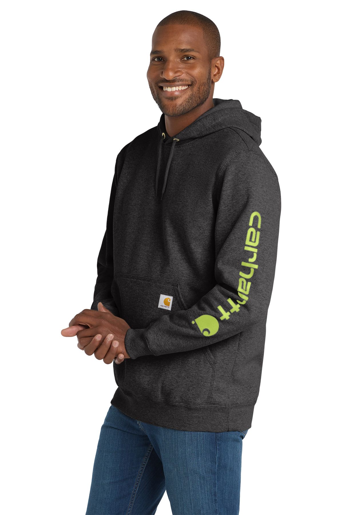 Man wearing a dark gray Carhartt hooded sweatshirt and blue jeans.