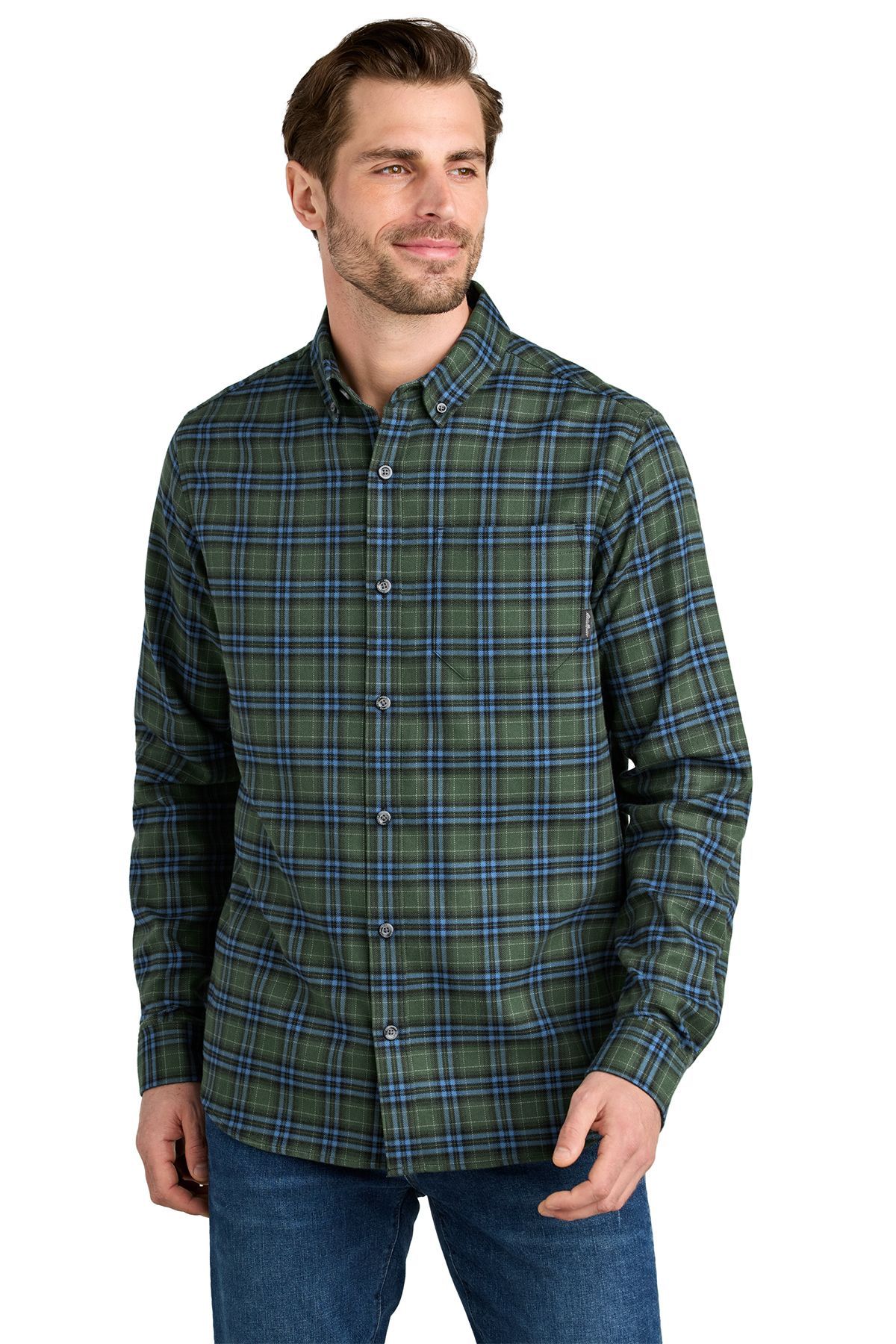 Man in green plaid shirt and blue jeans, looking slightly off-camera.
