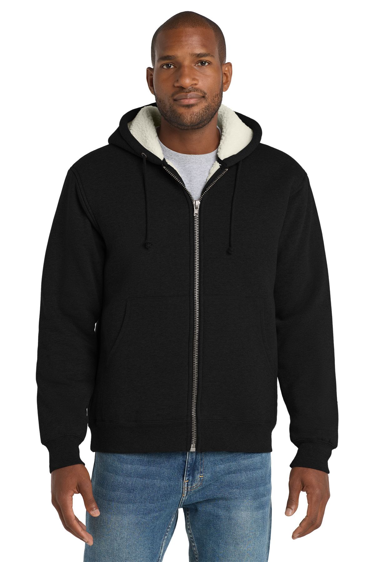 Man wearing a black hooded zip-up sweatshirt with a white sherpa lining, standing and looking forward.