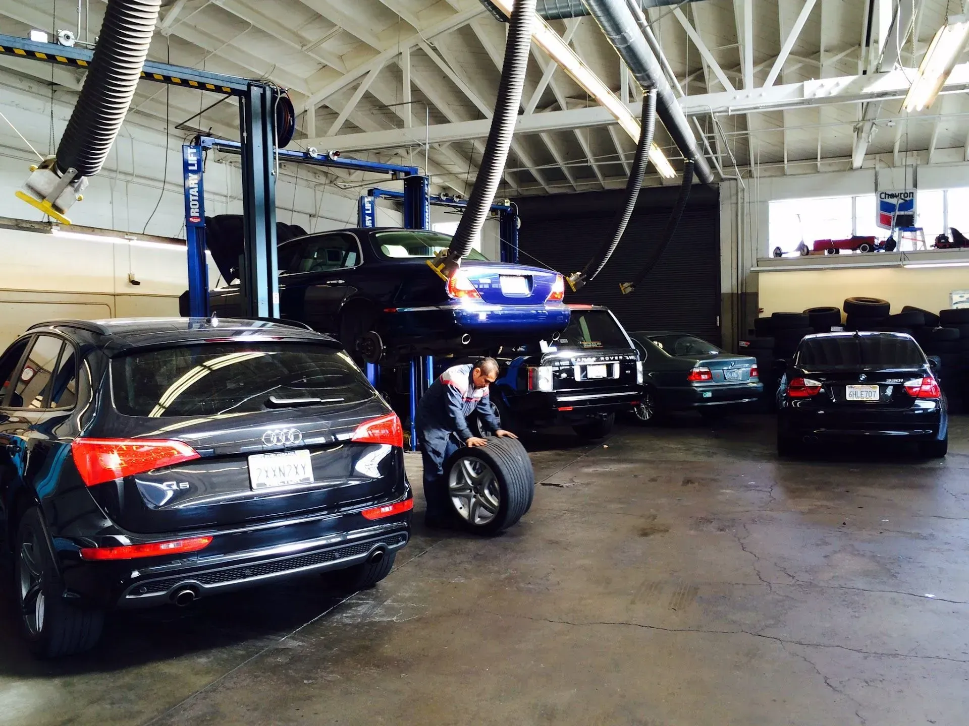 Busy Auto Repair Shop Interior With Vehicles In Service Bays | Brake And Wheel Service Center LLC