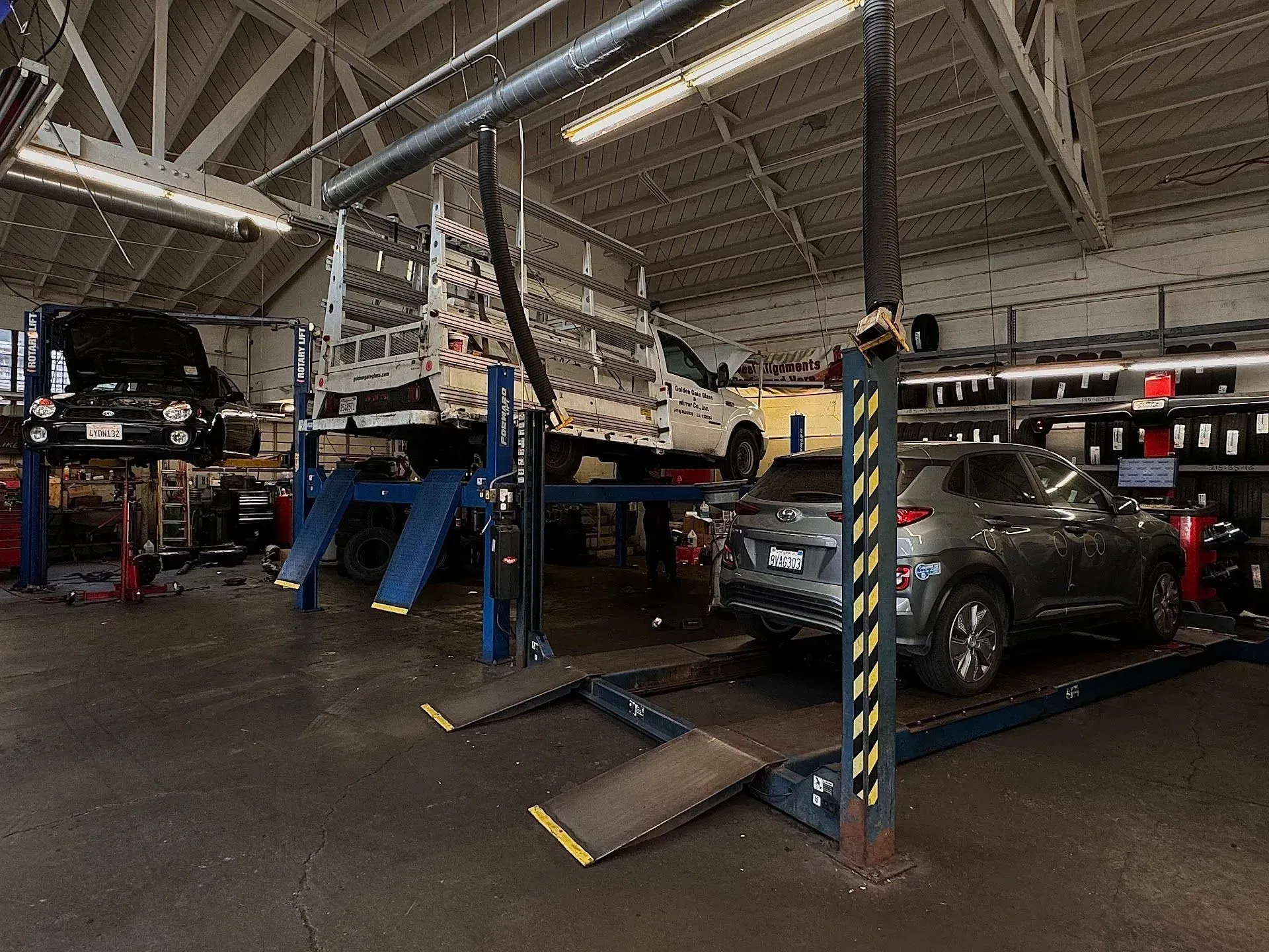 Auto Repair Facility With Multiple Vehicles On Lifts | Brake And Wheel Service Center LLC