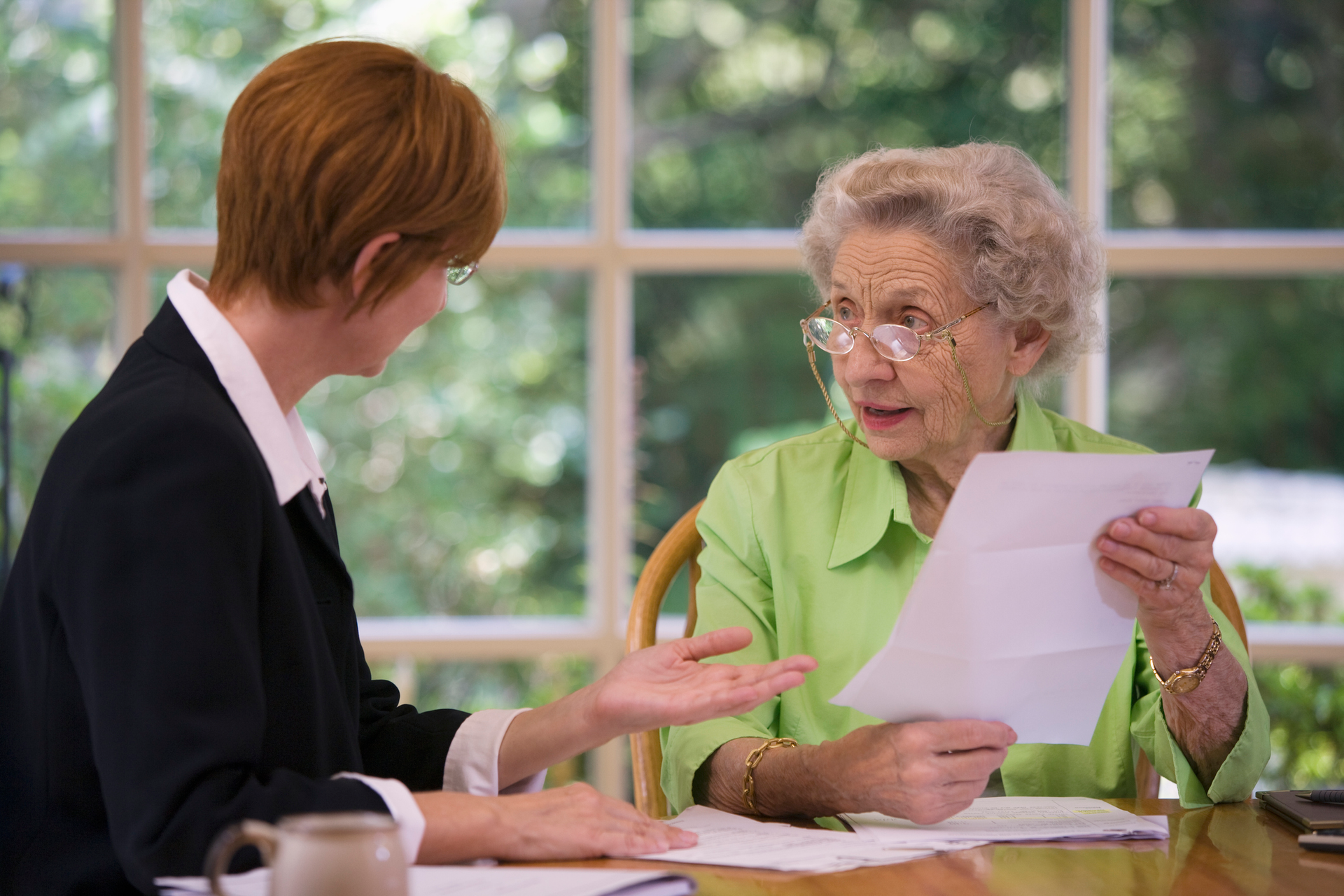 Estate planning lawyer at The Bone Law Firm in The Villages, FL, assisting a client in wills and est