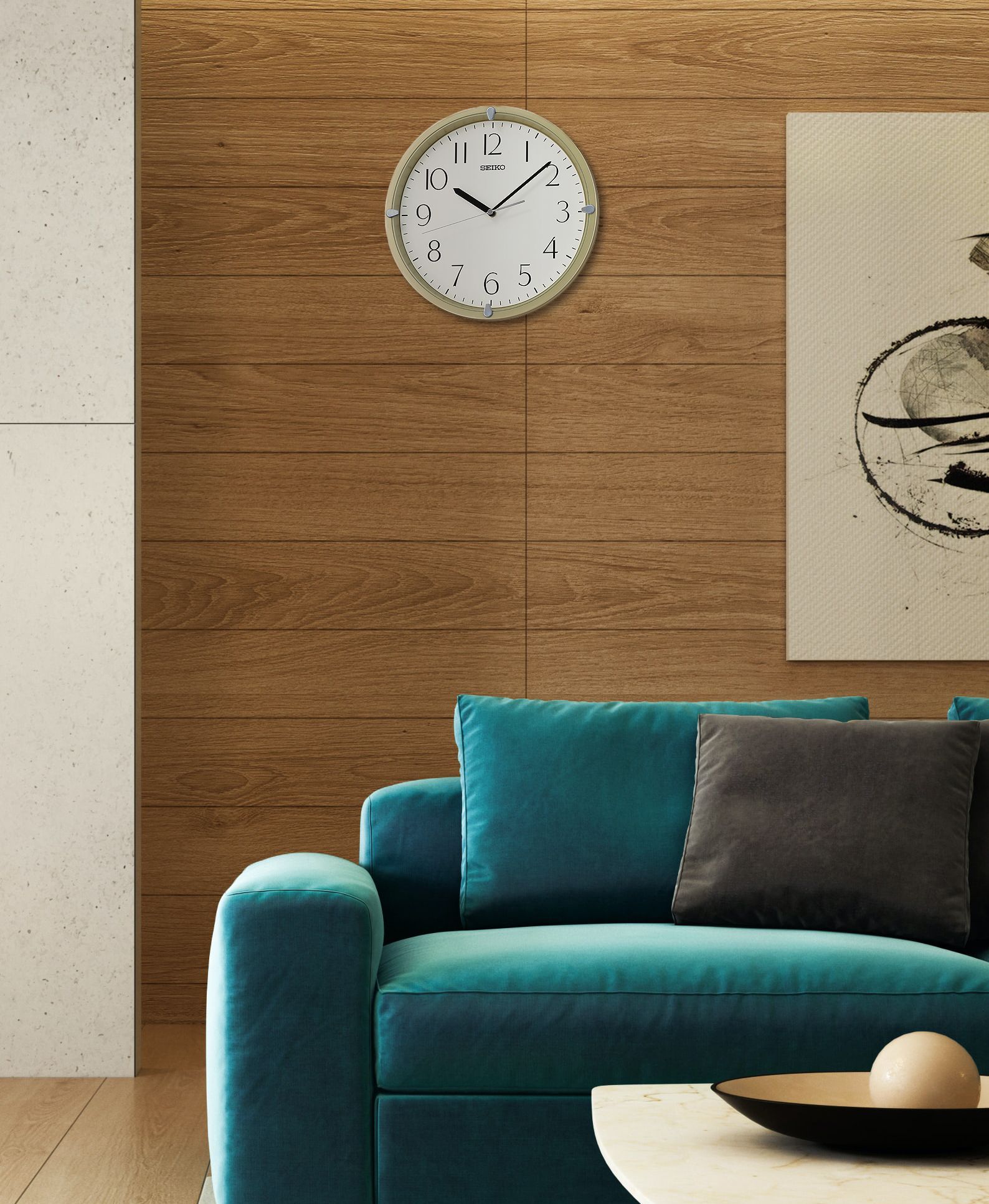 A living room with a blue couch and a clock on the wall