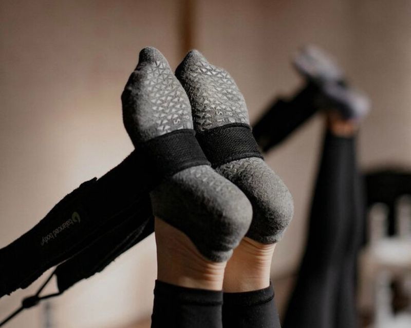 feet in straps pilates classes in Berkeley, Denver