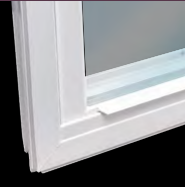 Close-up of a white window frame with a small chipped corner near the sill