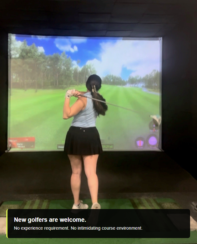 Golfer mid-swing in an indoor simulator, hitting toward a bright virtual fairway screen. Golfer mid-swing in an indoor simulator, hitting toward a bright virtual fairway screen.