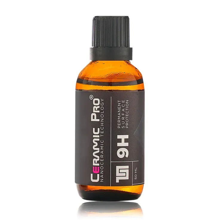 Amber bottle of Ceramic Pro 9H ceramic coating with a black label and cap.