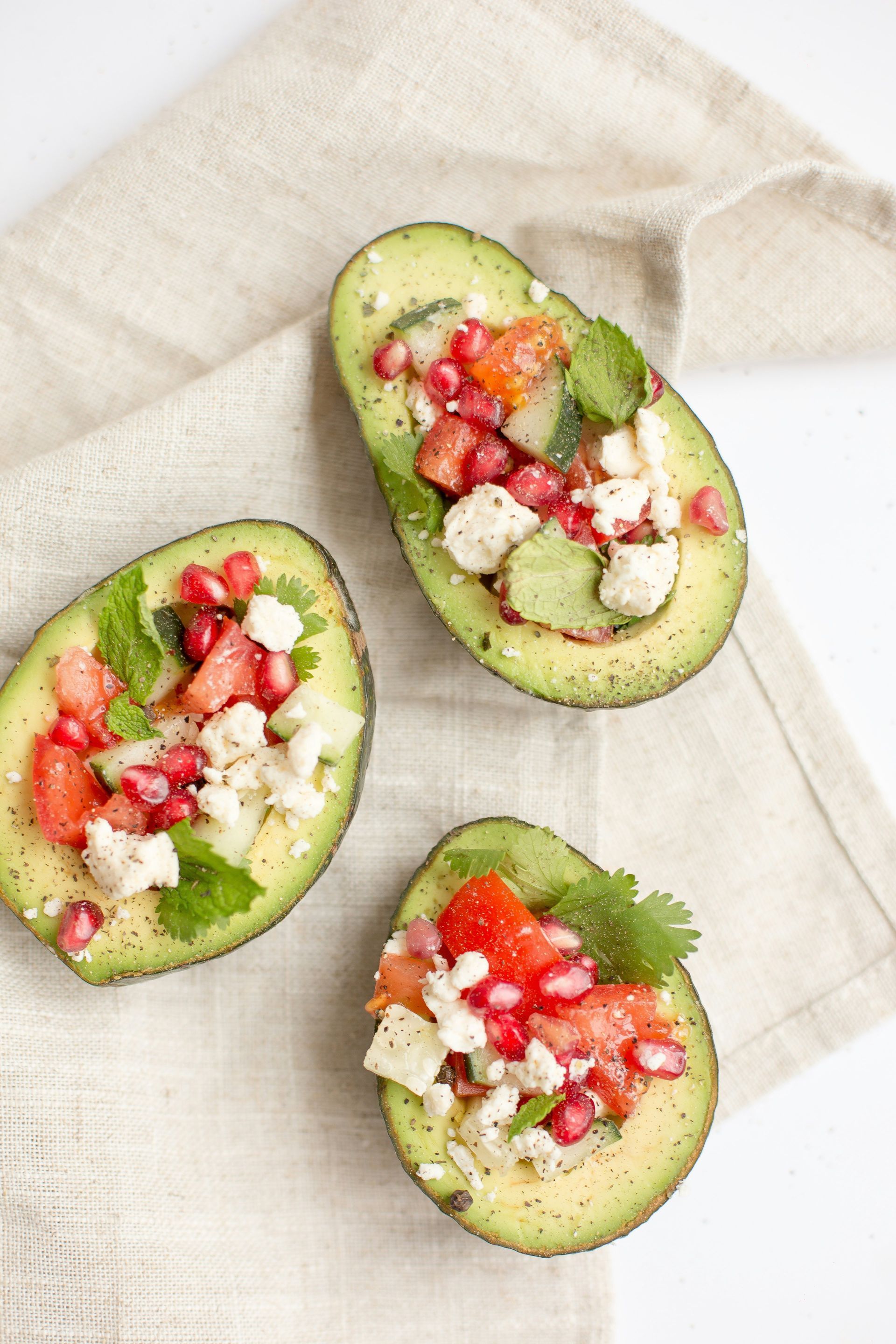 Two avocados with fresh toppings representing nutrition, health, and wellness at Her Form Studio.