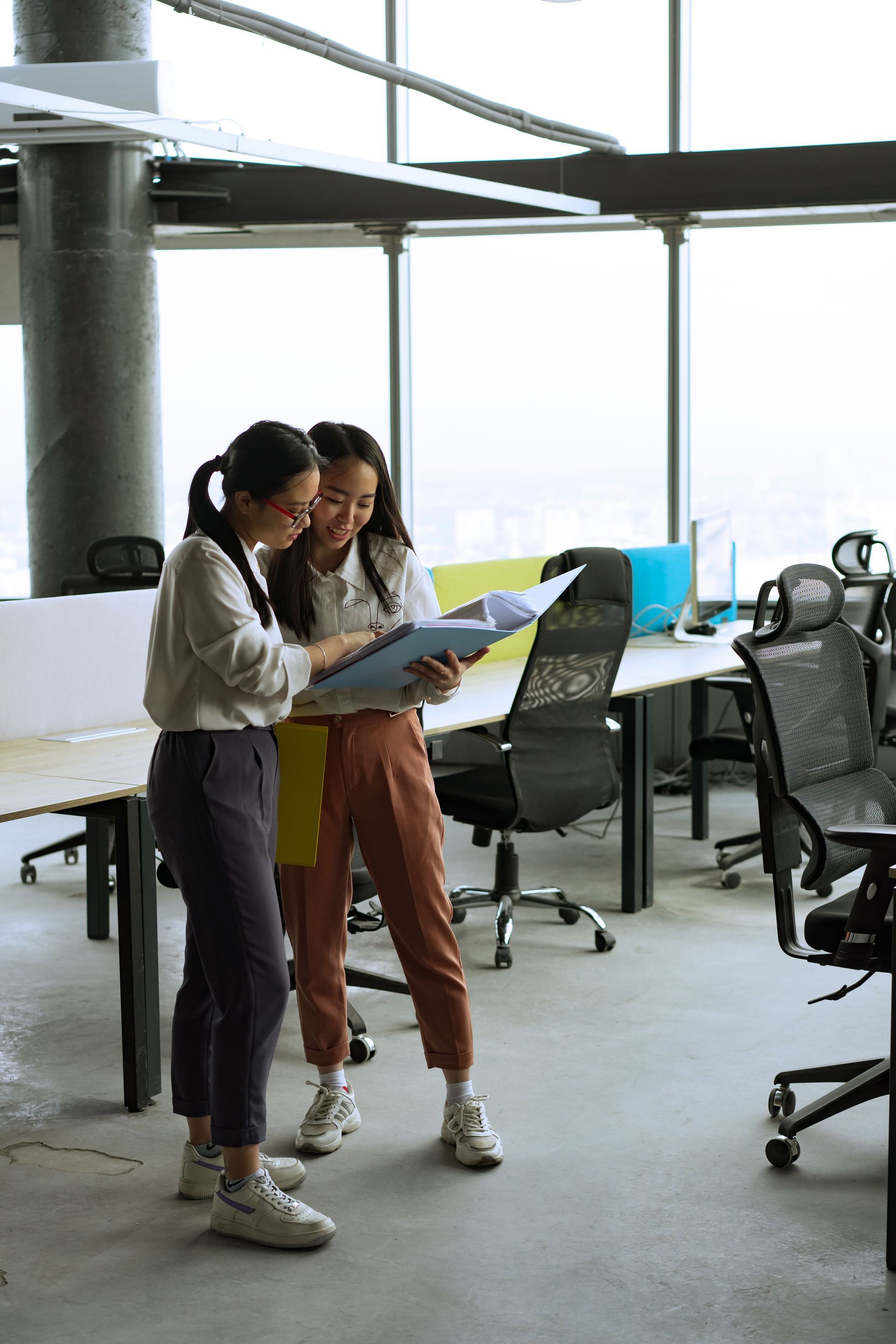 Employees reviewing workplace policies and HR compliance documents.