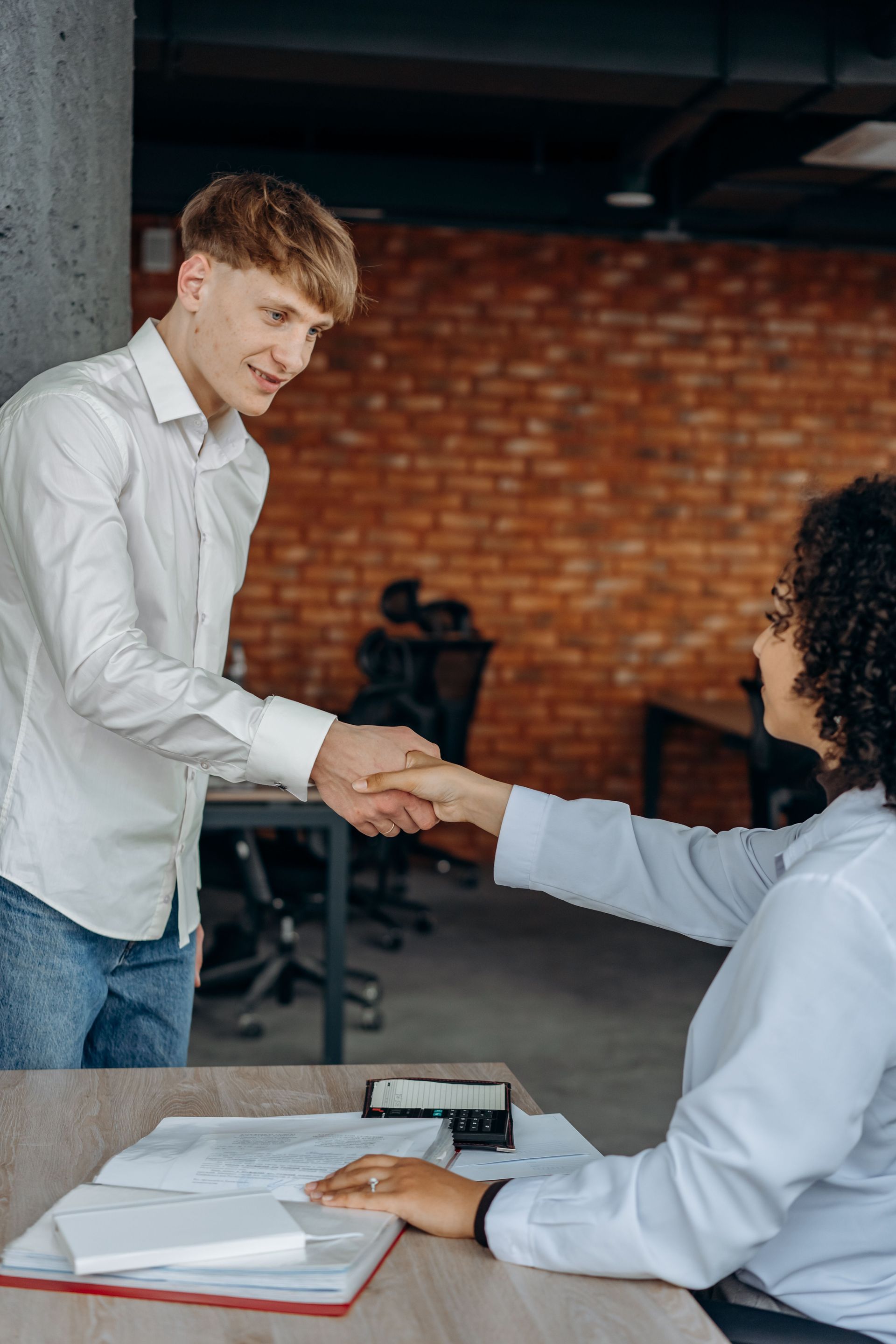 New employee being welcomed during the hiring and onboarding process.