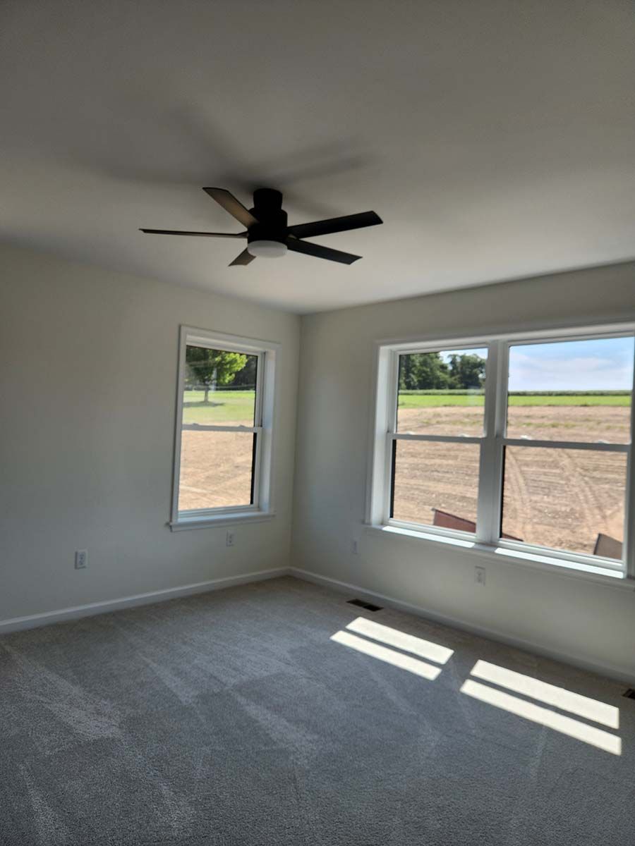 bedroom with 3 windows