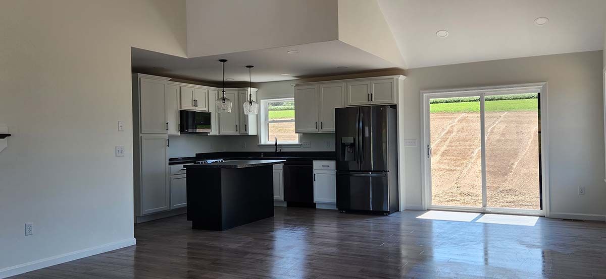 full view of kitchen including sliding door