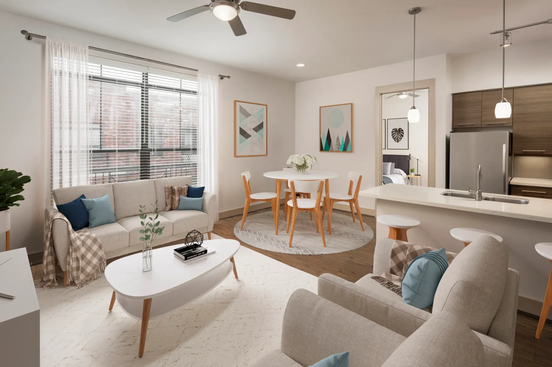 A stylish living room with a sofa, dining table, and kitchen appliances.