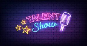 A neon sign for a talent show with a microphone and stars.