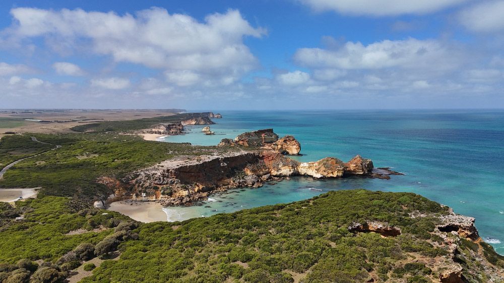 An Aerial View Of A Cliff Overlooking The Ocean — CAL AUTO Mobile Roadworthys in Childers, QLD