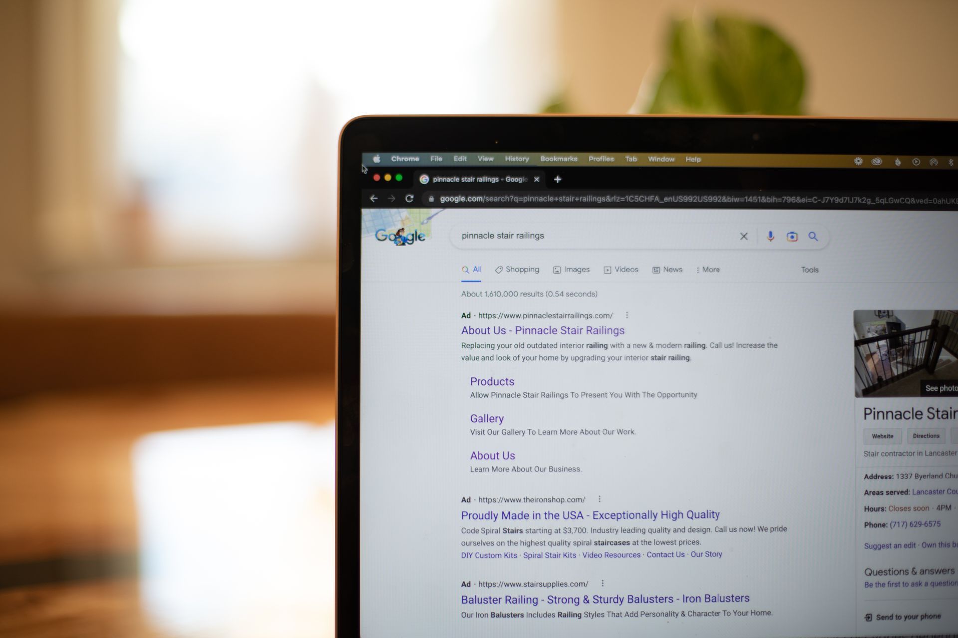 A laptop computer is open to a google search page.