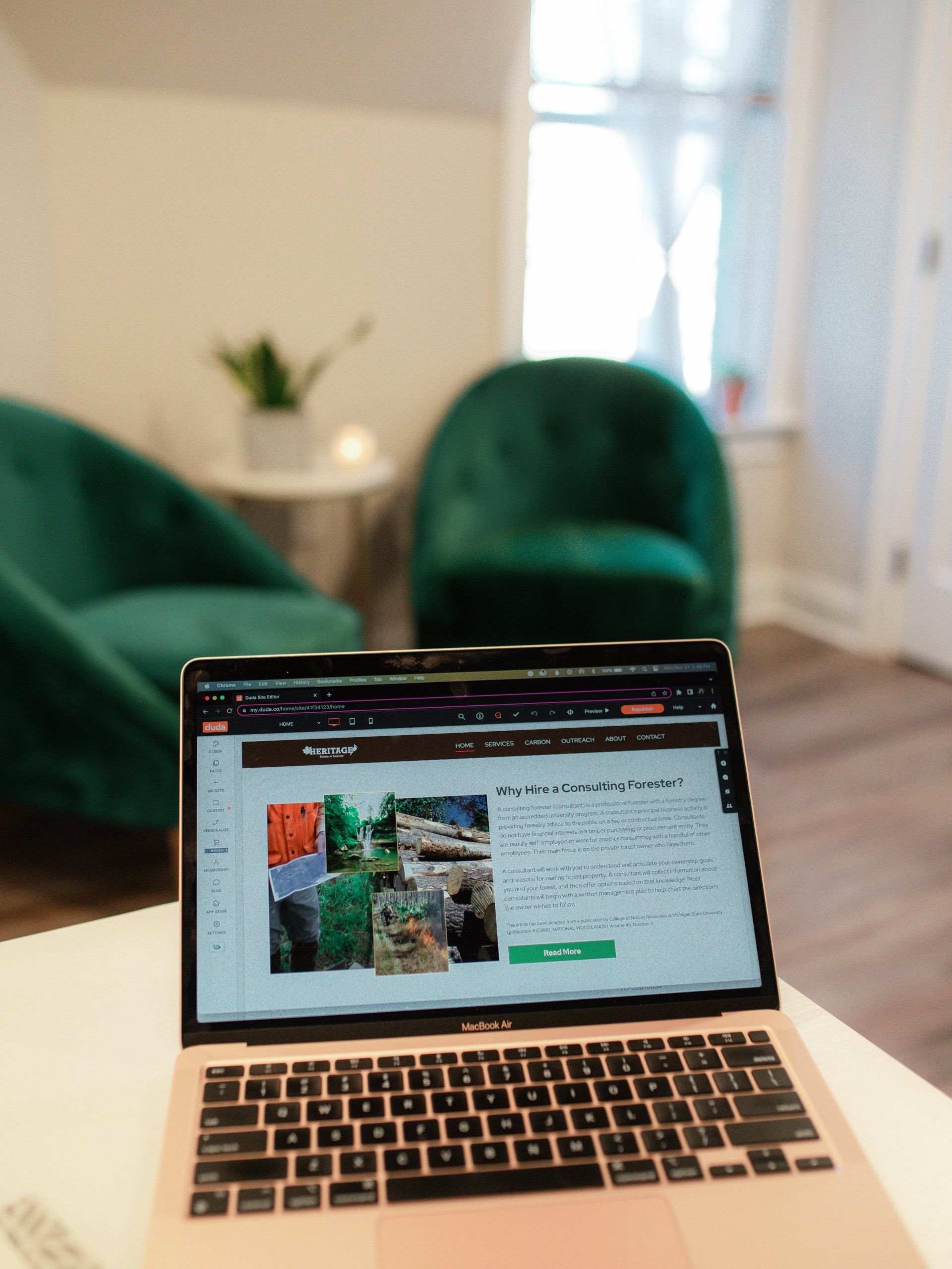 A laptop is open on a table in a living room