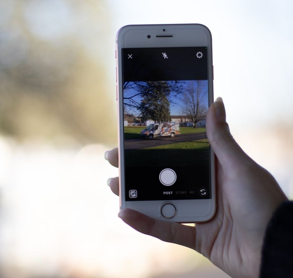A person is taking a picture with a cell phone