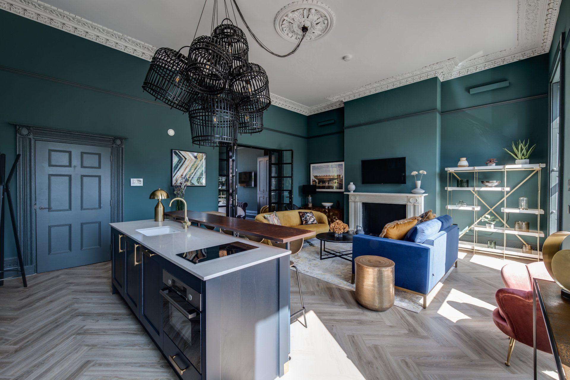 A living room with blue walls and a large island in the middle.