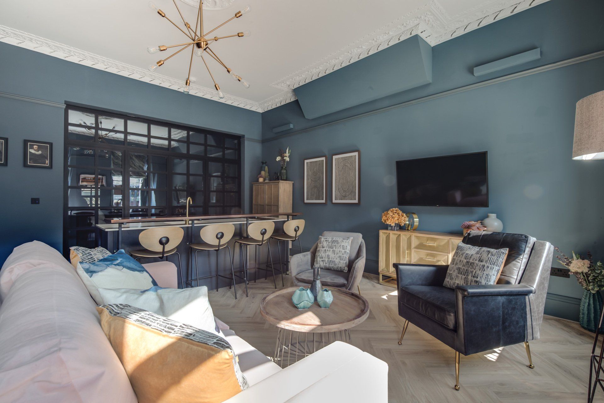 A living room filled with furniture and a flat screen tv.