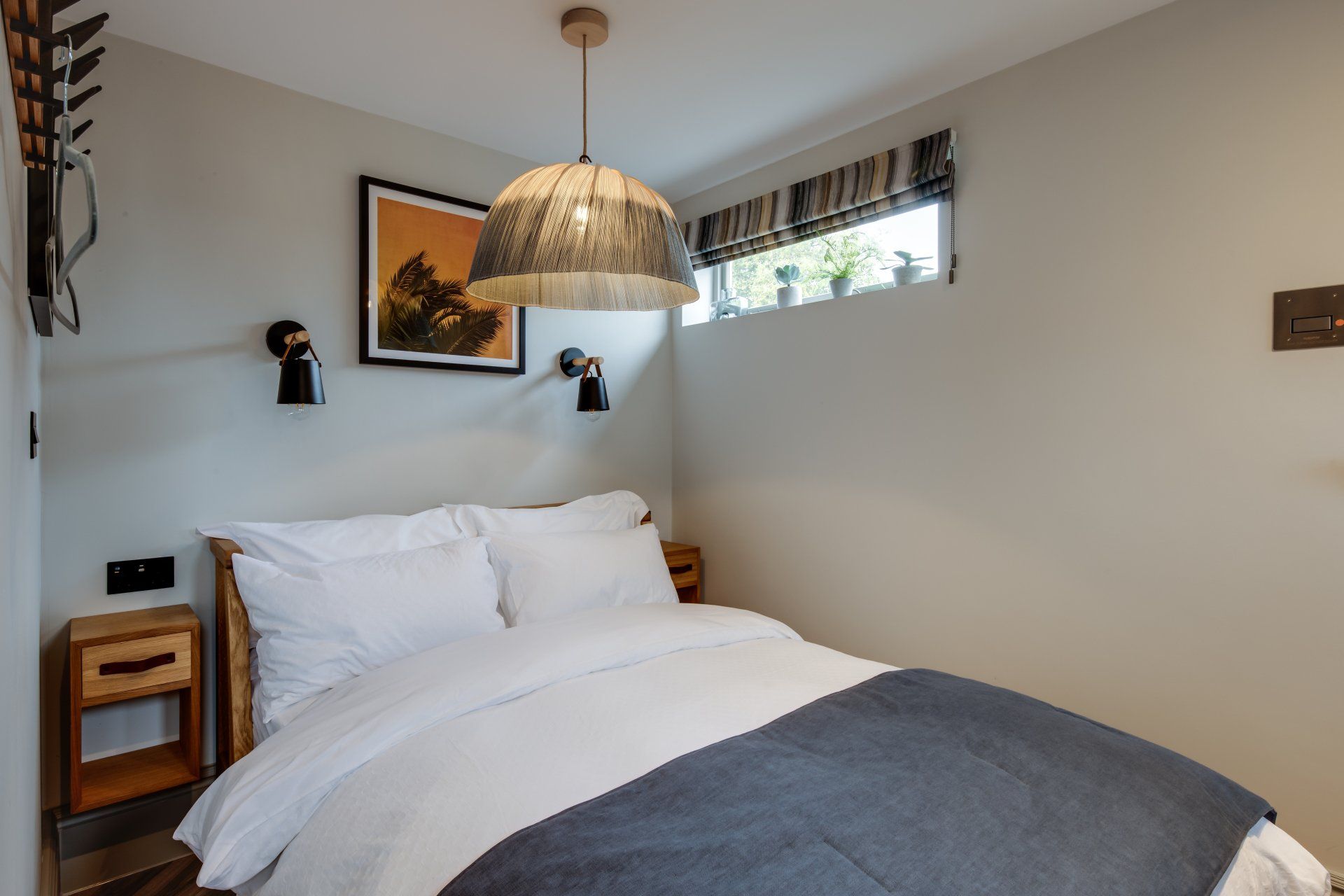 Double bed within the sleeping are of luxury serviced apartment from Neptune Apartments in Cheltenham