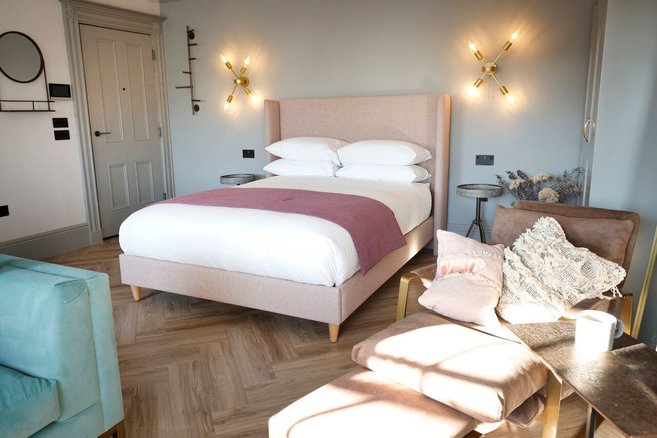 There is a large bed in the middle of the room.