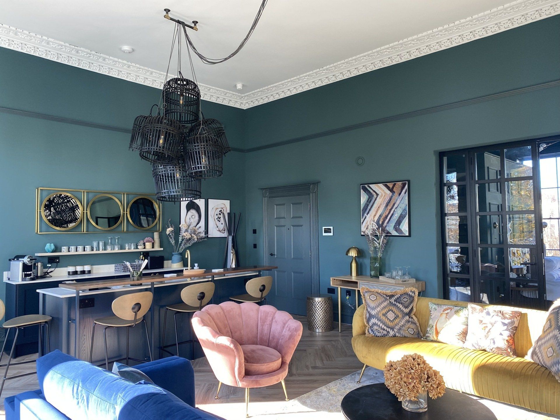 A living room filled with furniture and a chandelier.