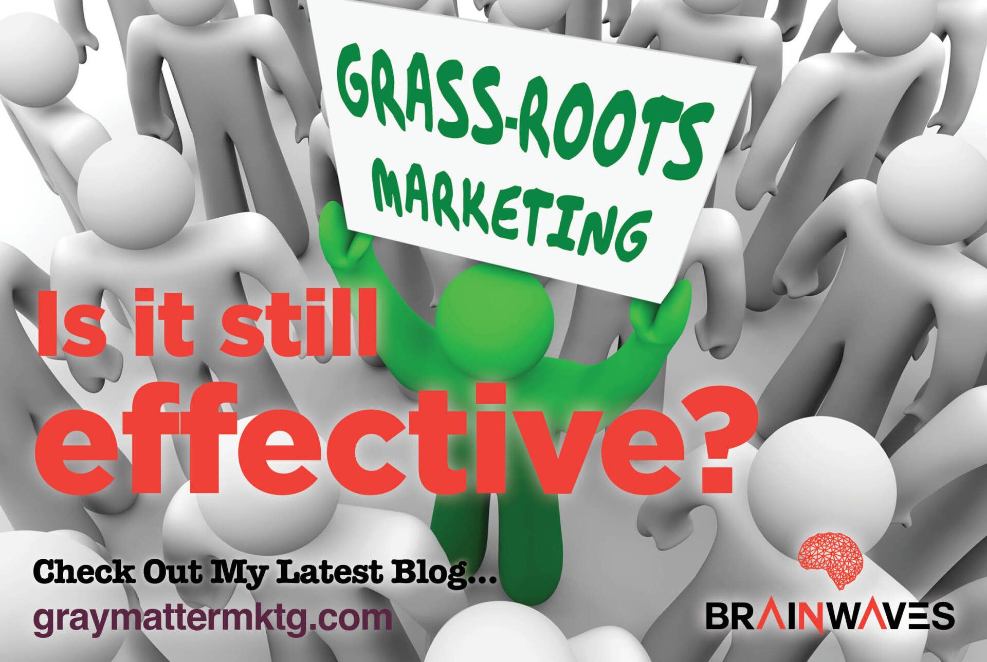 A green man is holding a sign that says grass-roots marketing